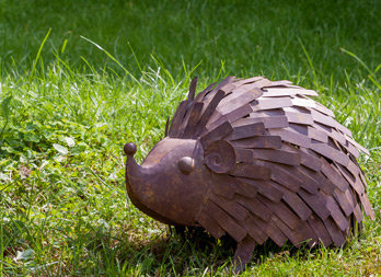 Hedgehog figure to stand near a flowerbed